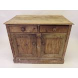 A pine cupboard with two drawers over cupboard - 24" x 40"