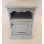A blue painted pot cupboard