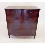 A mahogany reproduction chest of two short and three long drawers