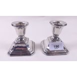 A pair of squat silver candlesticks, Birmingham 1934