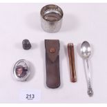 A group of silver items and a white metal mounted cigarette holder