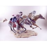 A large porcelain group of two arabs on horseback made by David Fryer ex employer of Royal Worcester