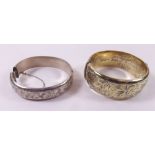 Two silver gilt hinged bangles