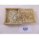 An early 20th century Chinese ivory puzzle box carved garden scenes