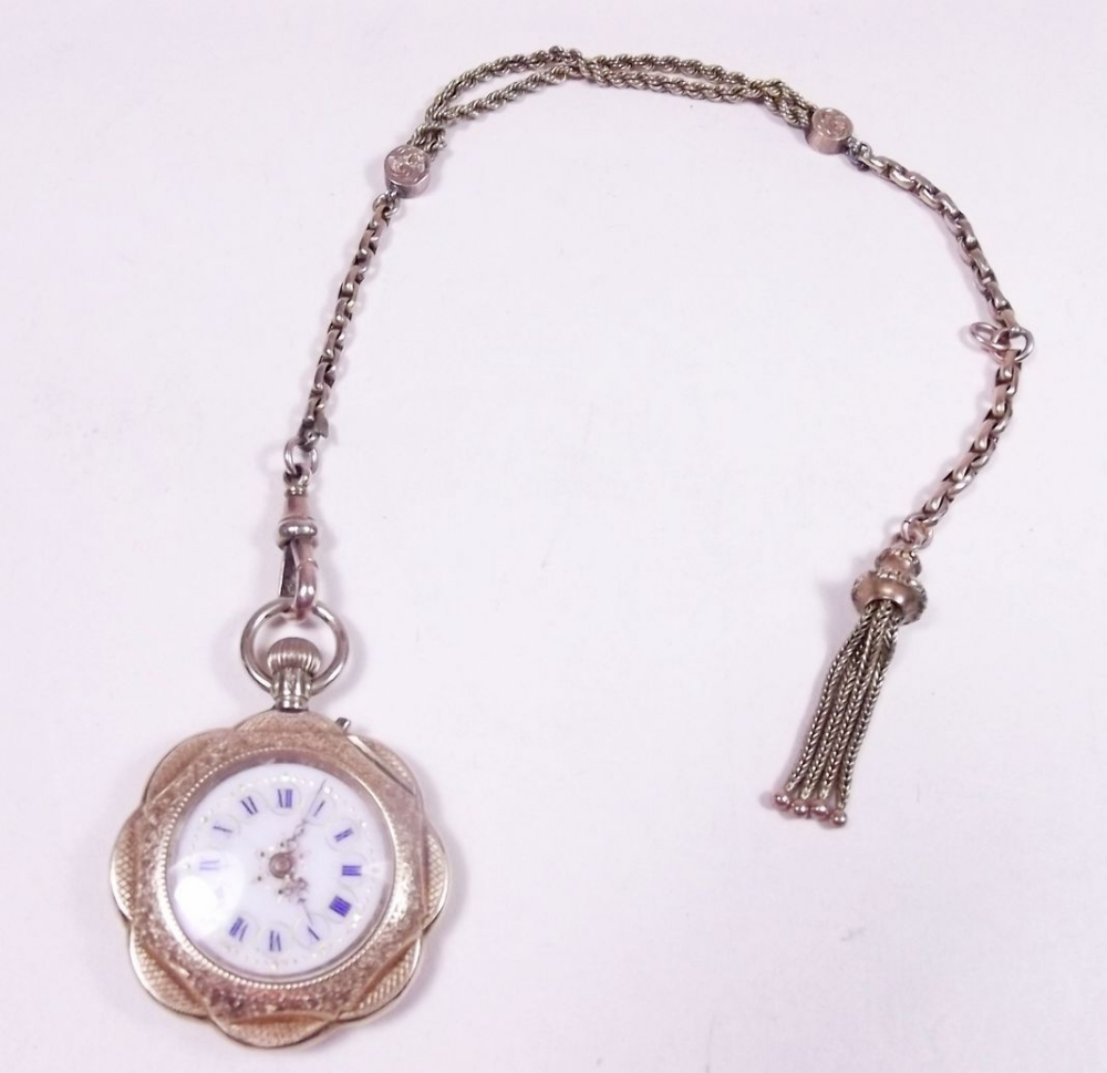 A 14 carat gold fob watch with enamel face on 9 carat gold fob chain