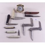 A collection of penknives and a childs hunting knife