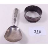 A silver caddy spoon Birmingham 1831, maker T & P and a silver napkin ring
