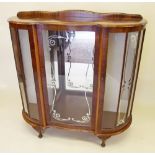 A 1950's glazed walnut display cabinet