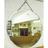 A circular frameless mirror