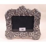 A modern silver photograph frame decorated flowers - 21 x 22cm