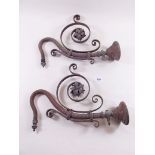 A pair of antique scroll wall gas lamps