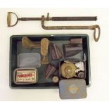 A box of collectable including shoe lasts, flat irons and a stirrup pump