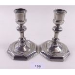 A pair of silver plated octagonal candlesticks
