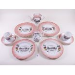 An Edwardian teaset printed scenes of Badminton village and house comprising:- five tea cups and