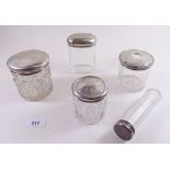 Five cut glass and silver topped dressing table jars