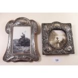 Two silver picture frames , 15 x 14 and 21 x 15cm.