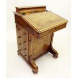 A Victorian walnut Davenport desk with raised gallery back over slope front and drawers to side