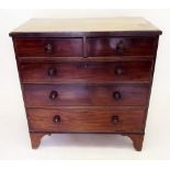 An early 19th century mahogany chest of two short and three long drawers
