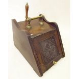 A Victorian carved coal scuttle and scoop