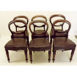 A set of six Victorian mahogany balloon back dining chairs with reeded supports