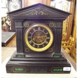 A Victorian black slate and malachite mantel clock