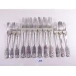 A set of six silver dinner forks and six silver dessert forks with engraved leopards head crest