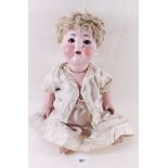 A porcelain headed doll with jointed composition body "Porcellanfabrik Burgrib No 169 3/2" Germany
