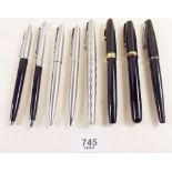 Four Parker ink pens and four Parker biros