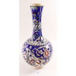 A Turkish Isnik style long necked vase 31cm high