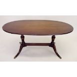 A reproduction oval coffee table