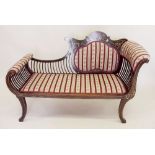 A Victorian mahogany rococo style salon settee, the raised back ornately inlaid satinwood and '