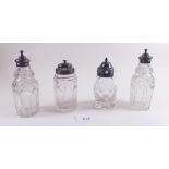 Four cut glass and silver mounted cruet bottles