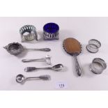 A small silver plated child's hand mirror and other silver plated items