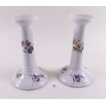 A pair of Victorian painted candlesticks