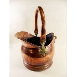 A copper coal scuttle