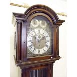 An oak longcase clock with brass face and three train striking movement by Bruford & Son