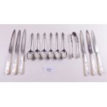 A set of six mother of pearl handled tea knives and six silver apostle teaspoons and tongs