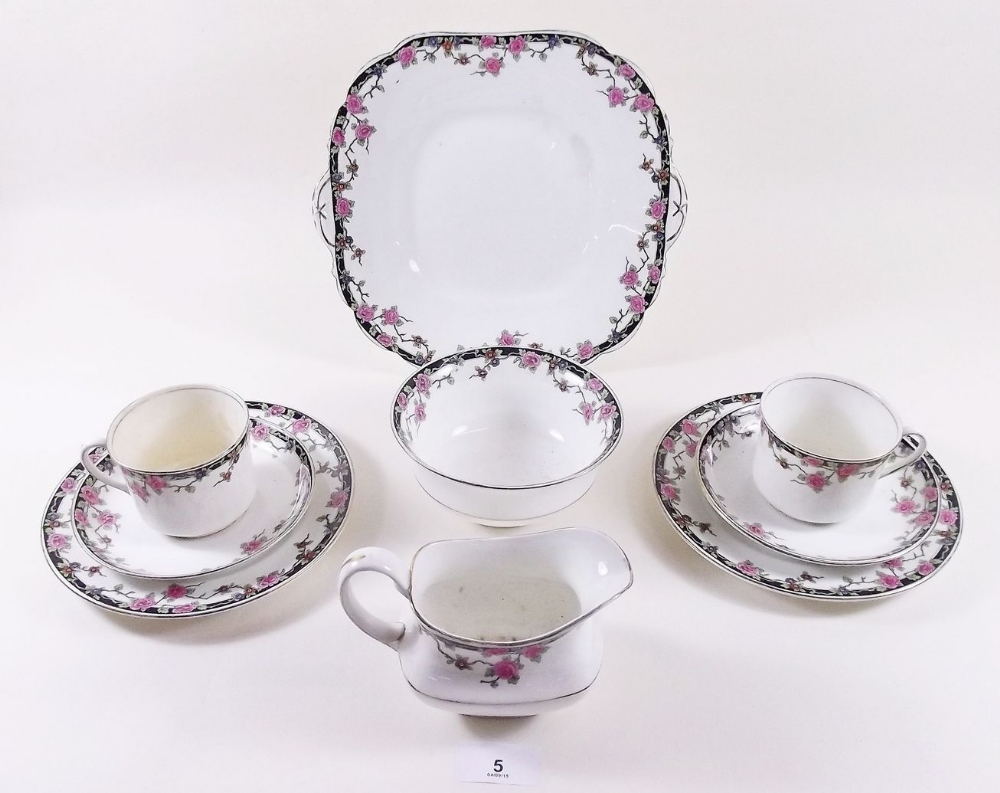 An Aynsley part teaset painted roses comprising: five cups and saucers, jug, sugar, five tea