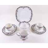 An Aynsley part teaset painted roses comprising: five cups and saucers, jug, sugar, five tea