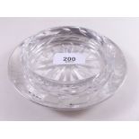 A cut glass and silver butter dish