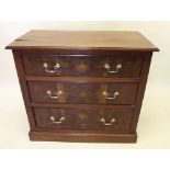 An Edwardian walnut chest of two short and three long drawers