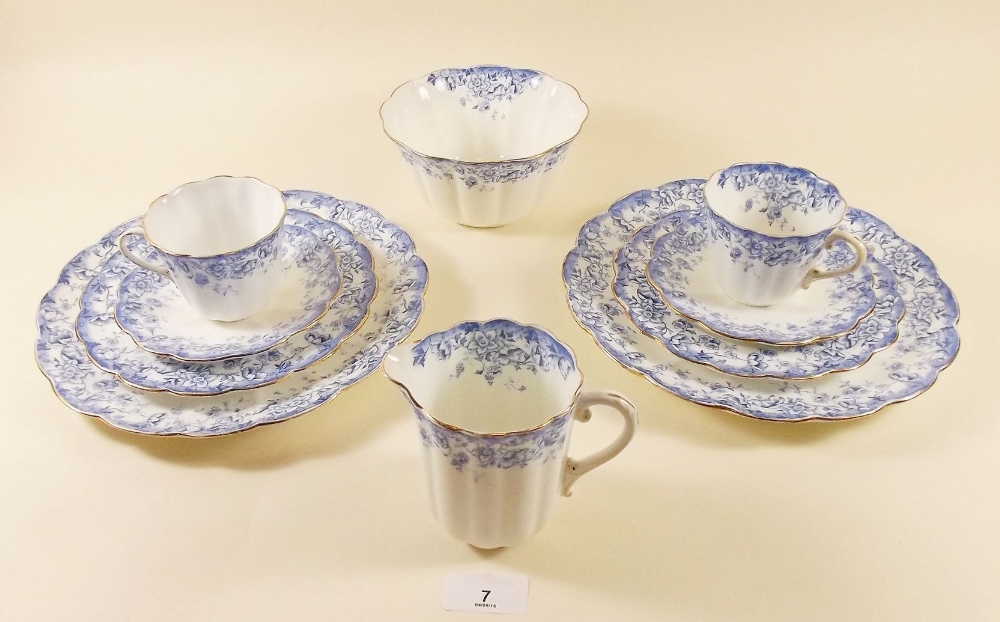 An Edwardian blue floral teaset by Tuscan China comprising: ten cups and saucers, twelve tea plates,