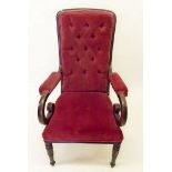 A Victorian red button upholstered chair with scroll over arms