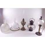 A Victorian oil lamp shade, three various small oil lamps etc.