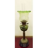 A Victorian brass and  oil lamp with green shade and reservoir