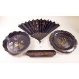 Two papier mache plates, a Chinese lacquer pen tray and a fan