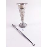 A silver tapered vase and a button hook