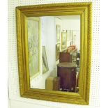 An antique gilt framed mirror with acanthus leaf moulded decoration 89 x 69cm - glass replaced