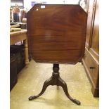 A 19th century mahogany square tilt top occasional table on carved column and paw feet