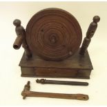 An early 19th century oak and elm lace winder with drawer to base a/f